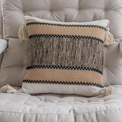 Khaki pixel-knit pillowcases with tassels