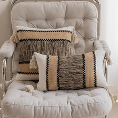 Khaki pixel-knit pillowcases with tassels