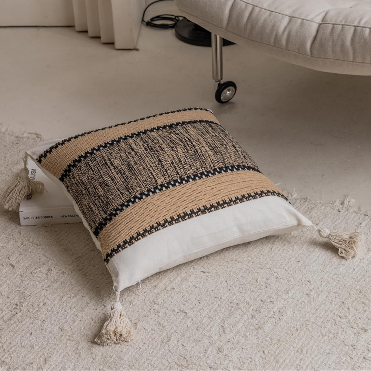 Khaki pixel-knit pillowcases with tassels