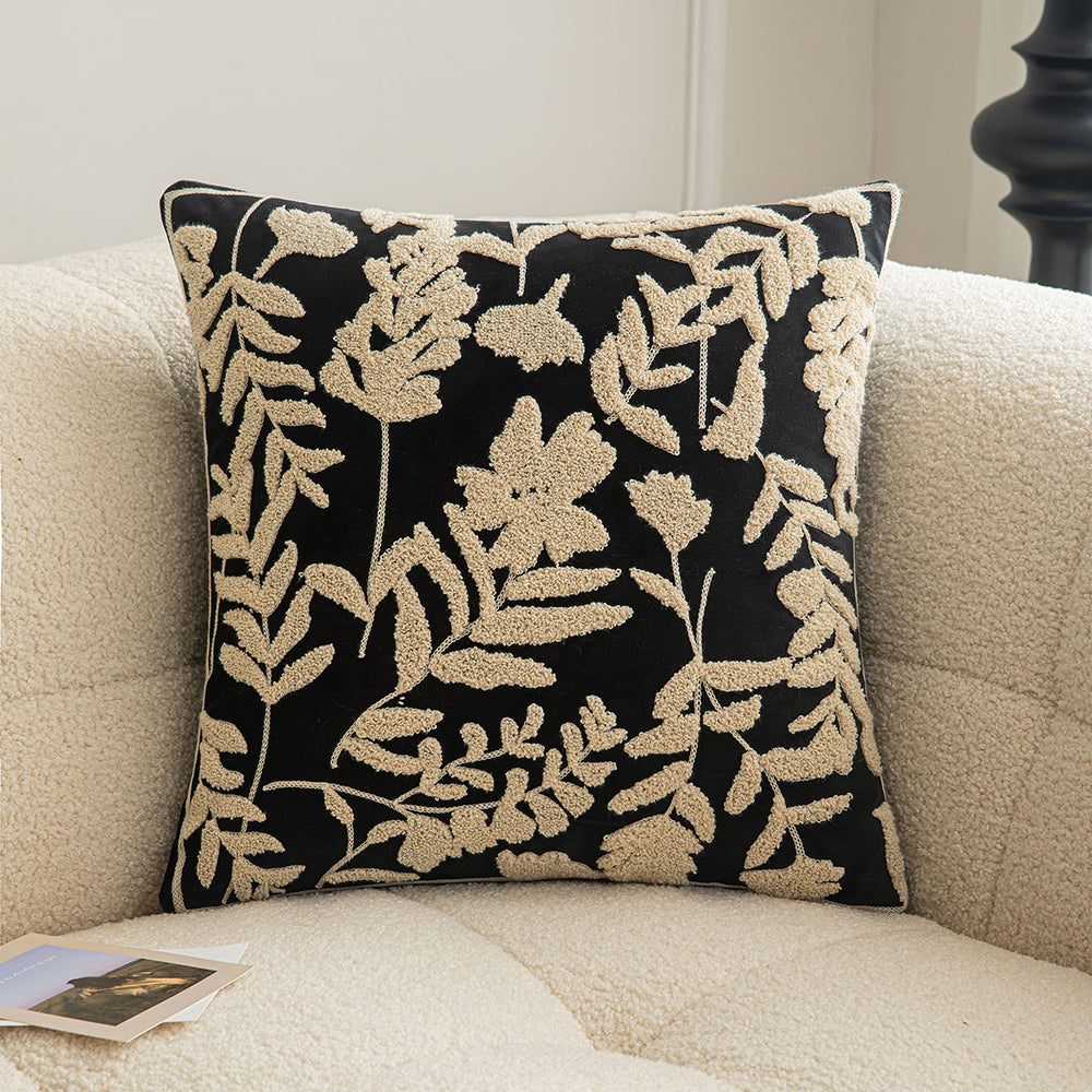 White embroidered floral pillowcases on black background