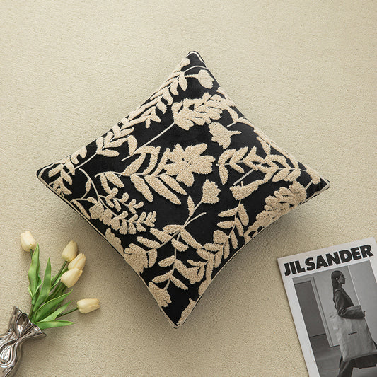 White embroidered floral pillowcases on black background