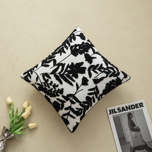 Black embroidered floral pillowcases on white background