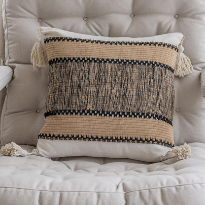 Khaki pixel-knit pillowcases with tassels