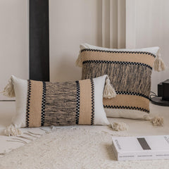 Khaki pixel-knit pillowcases with tassels