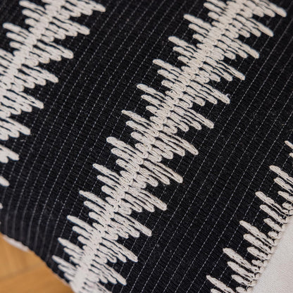Black leaf-patterned pillowcases with tassels