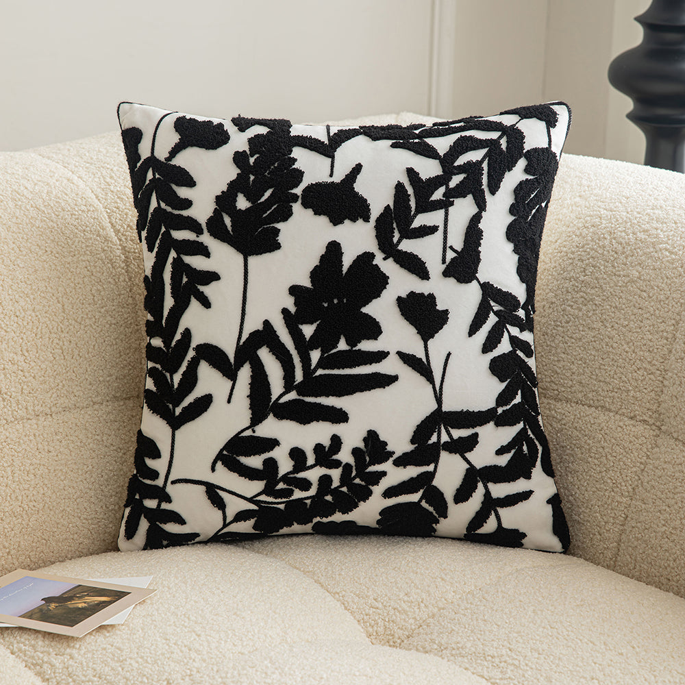 Black embroidered floral pillowcases on white background