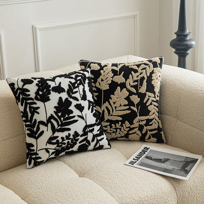 White embroidered floral pillowcases on black background