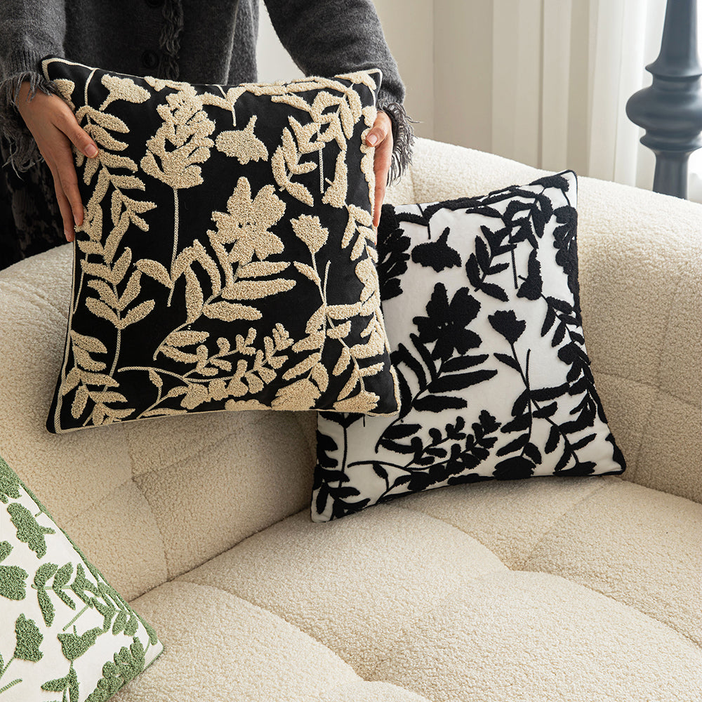 White embroidered floral pillowcases on black background