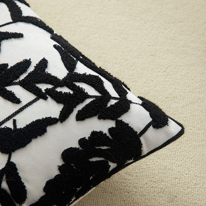 Black embroidered floral pillowcases on white background