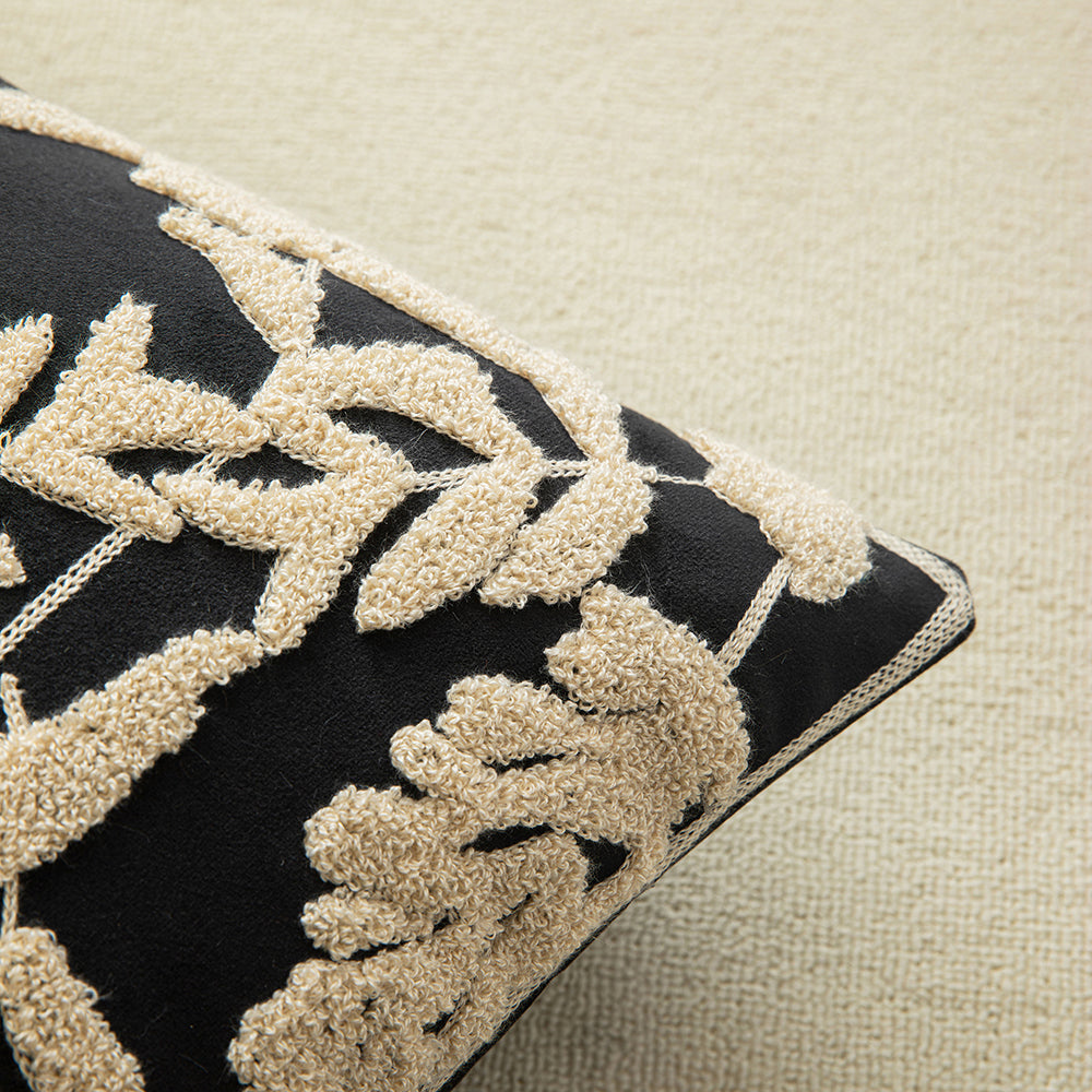 White embroidered floral pillowcases on black background