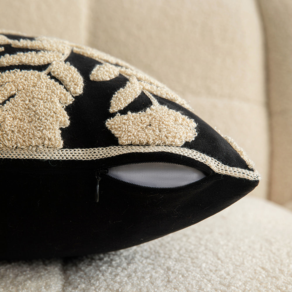 White embroidered floral pillowcases on black background